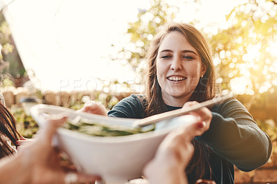 Buy stock photo Food, salad and healthy eating outdoor with woman giving or serving bowl with vegetables on patio for Christmas or thanksgiving lunch or dinner. Family or friends together to eat at home celebration