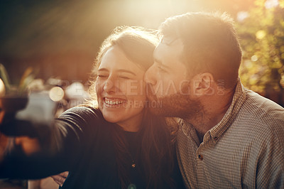 Buy stock photo Camera selfie, couple kiss and happiness outdoor in summer smile about bonding and care. Travel of a happy boyfriend and girlfriend in nature on a walking or hiking travel feeling freedom and love