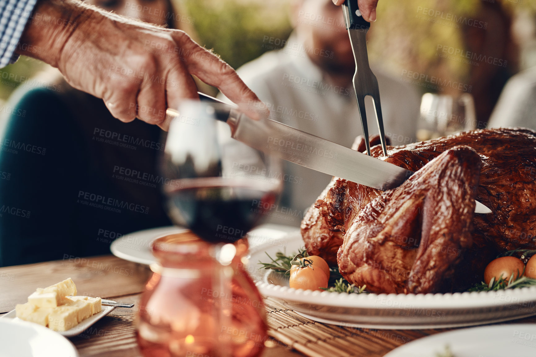 Buy stock photo Man cut turkey, chicken and food for thanksgiving, christmas and family lunch, dinner table setting or party, celebration and meal in home. Hands, knife and carving meat, poultry and feast for dining