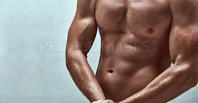 Buy stock photo Cropped studio shot of a handsome bare chested young man