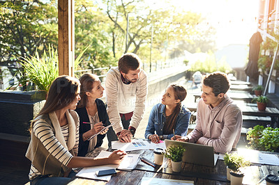 Buy stock photo Cropped shot of a group of colleagues having a meeting outside at a cafe