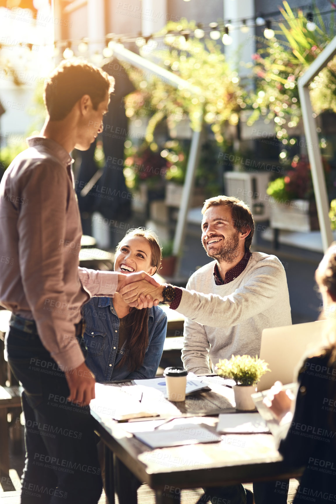 Buy stock photo Business people, group and shaking hands in meeting at cafe for welcome, b2b networking or collaboration outdoor. Team, employees and handshake for onboarding, partnership deal or happy for agreement