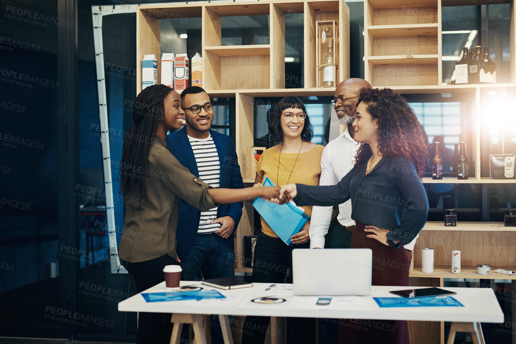 Buy stock photo Shot of a group of designers having a discussion in a modern office
