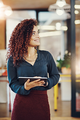 Buy stock photo Cropped shot of a businesswoman using a digital tablet while at the office