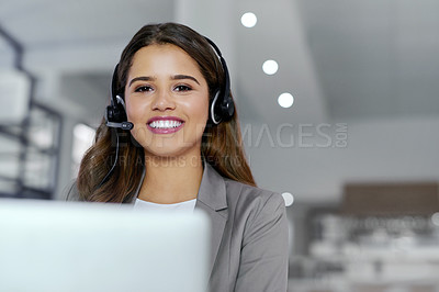 Buy stock photo Cropped portrait of a young female call center agent working in an office