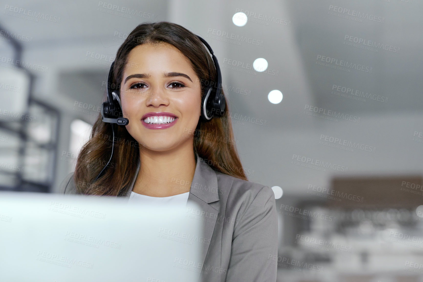 Buy stock photo Cropped portrait of a young female call center agent working in an office