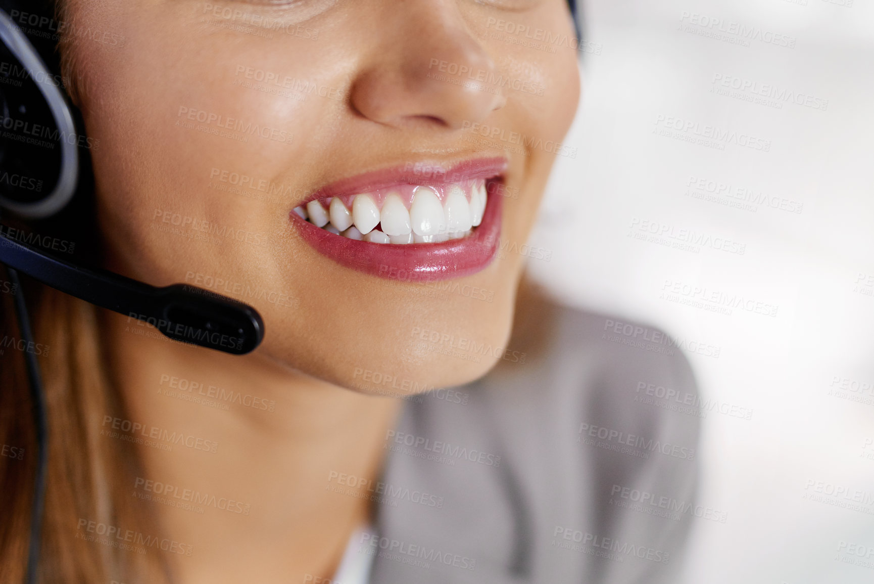 Buy stock photo Closeup shot of an unrecognizable young female call center agent working in an office