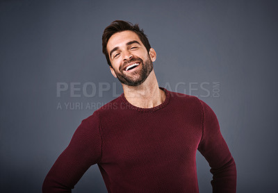 Buy stock photo Studio, happy and laughing of man, fashion and confidence in mockup space, pride and jersey for winter. Gray background, portrait and person in Miami, funny or comfortable in clothes, joy and sweater