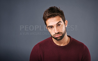 Buy stock photo Bored, portrait and annoyed man in studio unhappy and moody against a grey background space. Sad face of depression and man with negative attitude posing with isolated, whatever or tired expression 