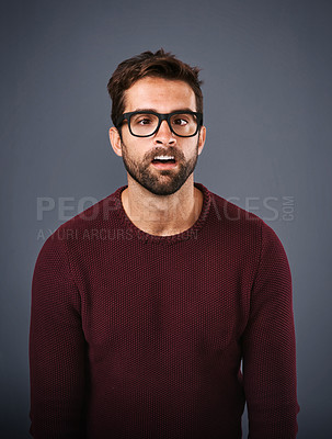 Buy stock photo Studio, glasses and man with funny face, eye care and wellness with frame, portrait and lens for vision. Gray background, healthy and product for person, prescription and eyewear with fashion in USA