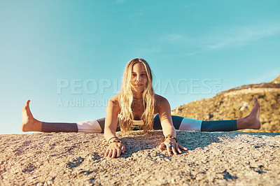 Buy stock photo Shot of an athletic young woman practicing yoga on the beach