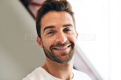 Buy stock photo Cropped portrait of a handsome young man standing in his bedroom at home