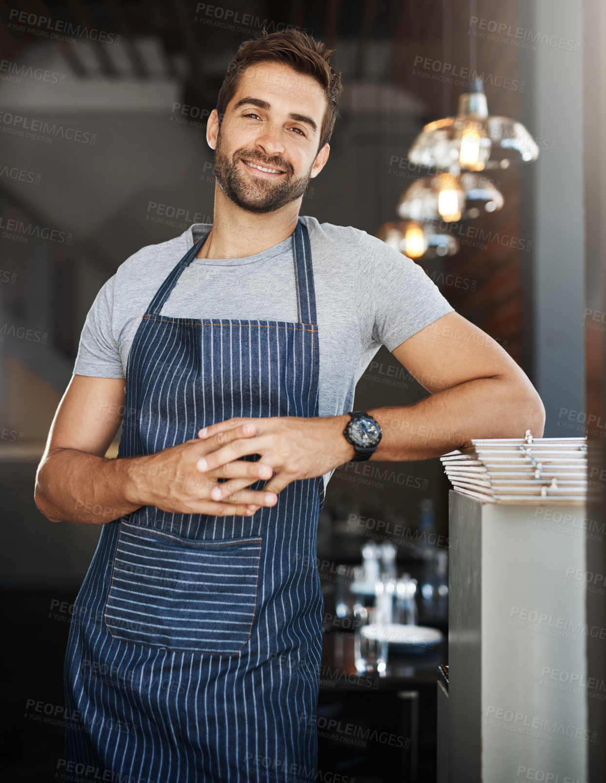 Buy stock photo Portrait, employee and man in cafe, apron and waiter with confidence, career ambition and hospitality. Face, happy person or entrepreneur with service industry, small business or server in restaurant