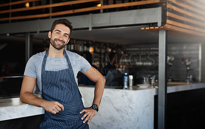 Buy stock photo Portrait, counter and man in cafe, apron and waiter with confidence, fine dining experience or hospitality. Face, person or friendly service with food industry, leaning and professional in restaurant