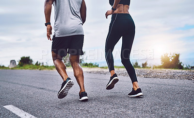 Buy stock photo Fitness, running and legs of couple on road, endurance training and cardio workout together for health. Sunshine, morning exercise or people with jog for pace development, outdoor practice and active