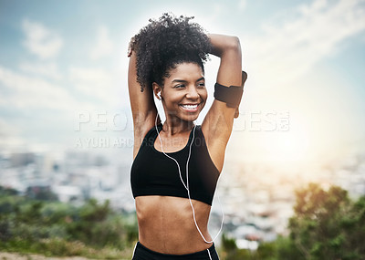 Buy stock photo Happy, woman and stretching arms for running outdoors with music for fitness, workout or cardio routine. Stretch, exercise and smiling African female runner in nature with podcast for training run