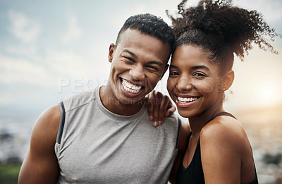 Buy stock photo Portrait of a sporty young couple exercising together outdoors
