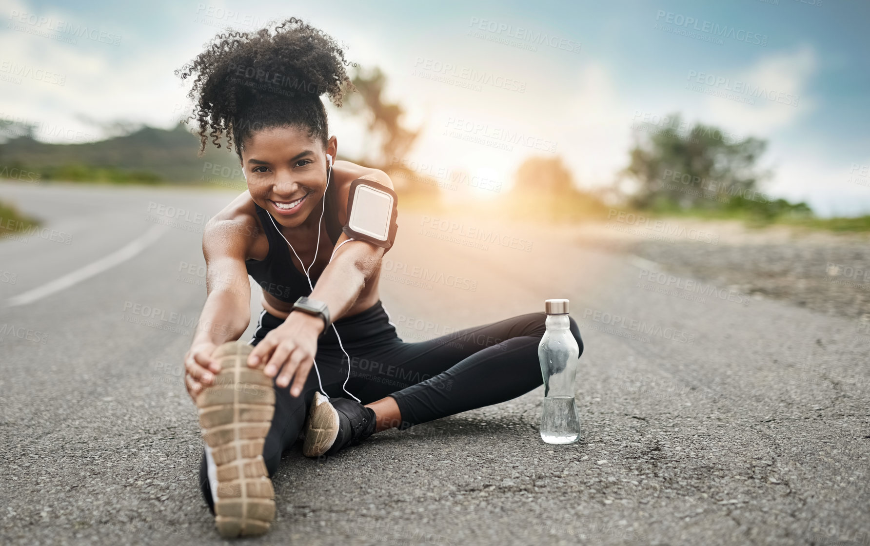 Buy stock photo Fitness, stretching and portrait of black woman with earphones for wellness, health and sports in city. Runner, happy and person listen to audio, music or podcast for exercise, training and workout 