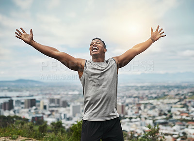 Buy stock photo Cropped shot of a handsome young sportsman cheering in celebration outside