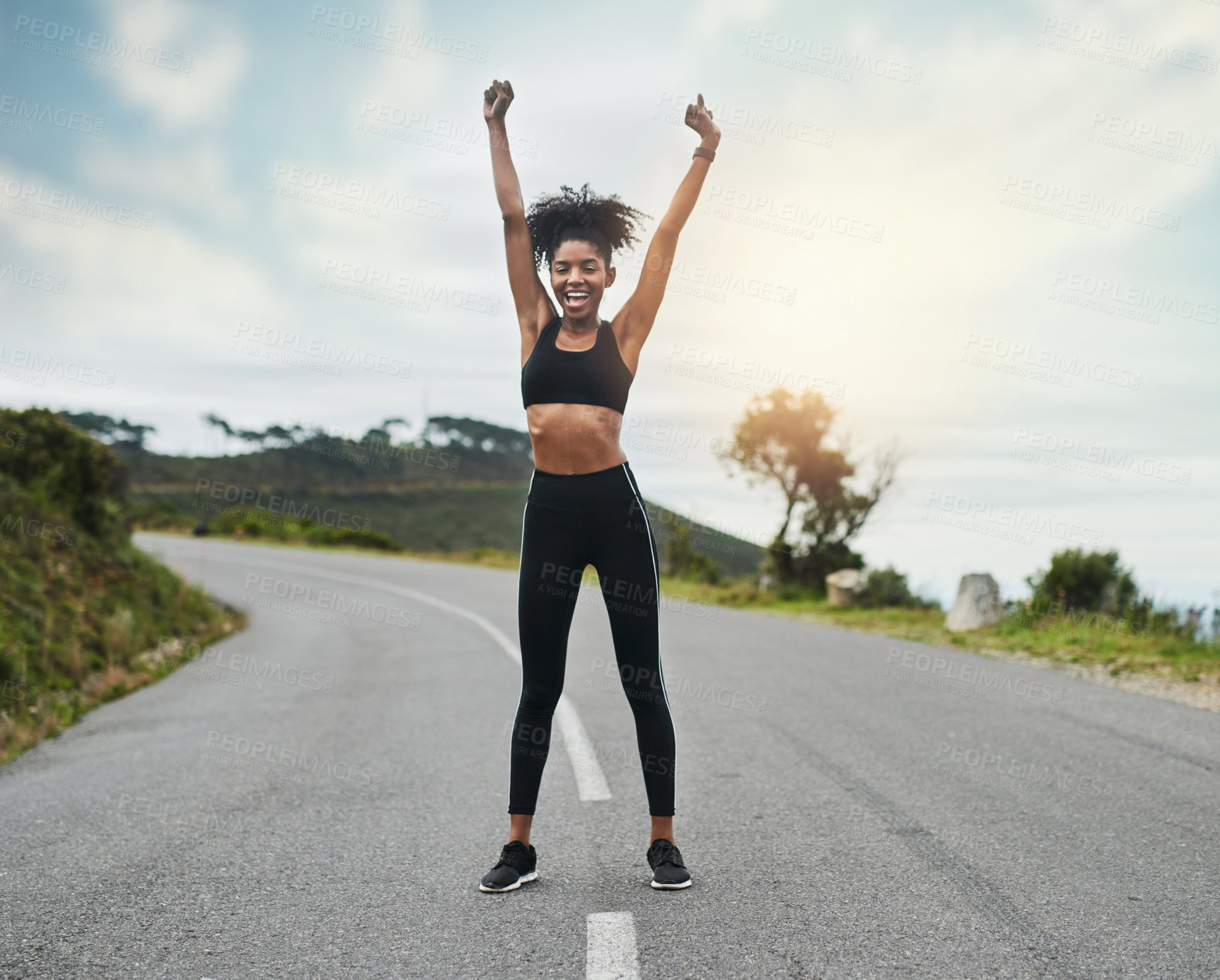 Buy stock photo Full length portrait of an attractive young sportswoman cheering in celebration outside