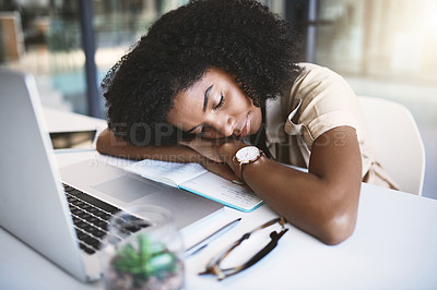 Buy stock photo Shot of a happy young businesswoman sleeping at her desk in a modern office