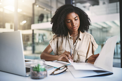 Buy stock photo African woman, paperwork and reading in office with smile, check and admin at media company. Person, journalist or writer with report, proposal and document for article review at creative agency