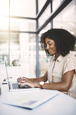 Buy stock photo African woman, laptop and typing in office with smile, check and admin at media company. Person, journalist or writer with report, editing and document with review for article at creative agency