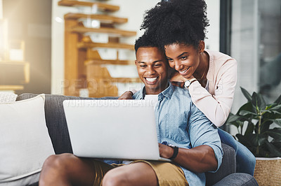 Buy stock photo Black couple, hug and smile with laptop in home for remote work, subscription and scrolling social media on sofa. People, embrace and technology in living room for online browsing and watching movie