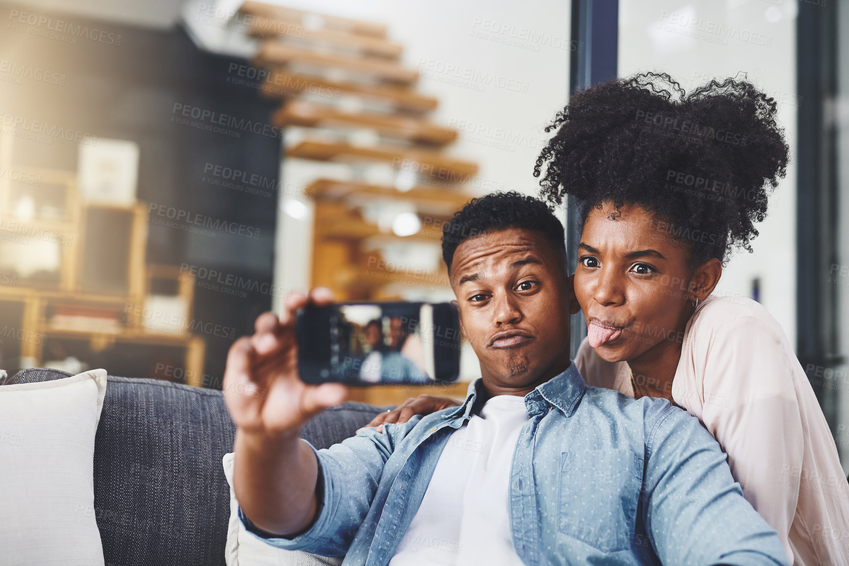 Buy stock photo House, screen and black couple with selfie, funny and bonding together with happiness, photograph and memory. Apartment, smartphone and man with woman, silly and goofy with social media and picture