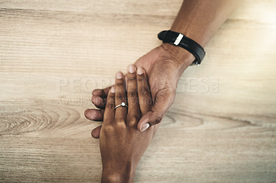 Buy stock photo Love, support and couple with holding hands on table for marriage, compassion and kindness. Top view, care and people with connection in commitment for partnership, understanding and forgiveness