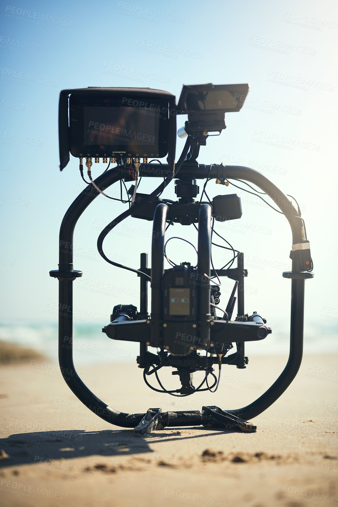 Buy stock photo Filmmaking, camera gear and equipment for photoshoot results, video content or quality control. Videography process, closeup and technology for nature, movie or professional production on beach sand