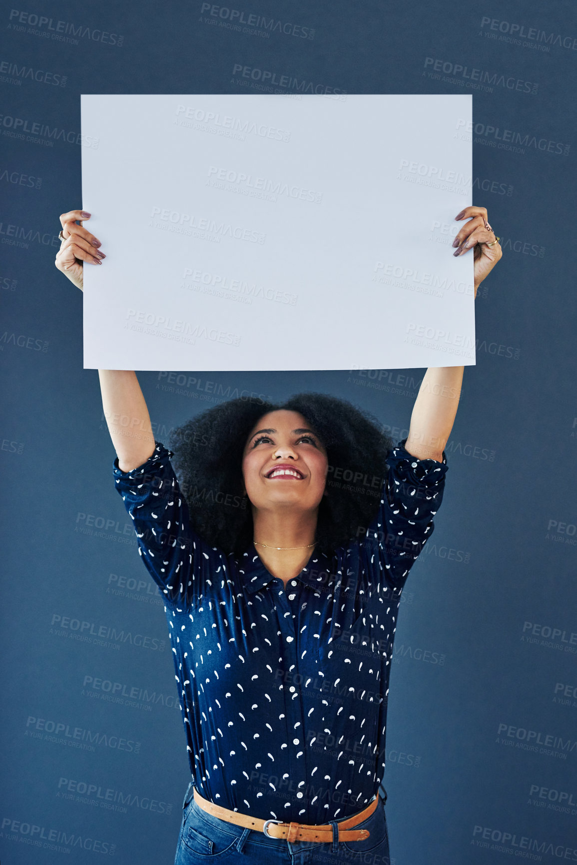 Buy stock photo Mockup, poster and happy woman in studio with banner for news, social media or advertising on blue background. Space, billboard and female person with paper, news and branding promotion or launch