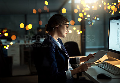 Buy stock photo Night, notes or business woman reading research or paperwork overtime working on digital strategy. Late, lens flare or focused employee with portfolio file for project deadline on internet in office