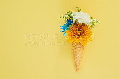 Buy stock photo Flowers ice cream in a cone in studio for creative, art or decoration with fresh and colorful bouquet. Creativity, still life and floral plants in a dessert isolated by yellow background with mockup.