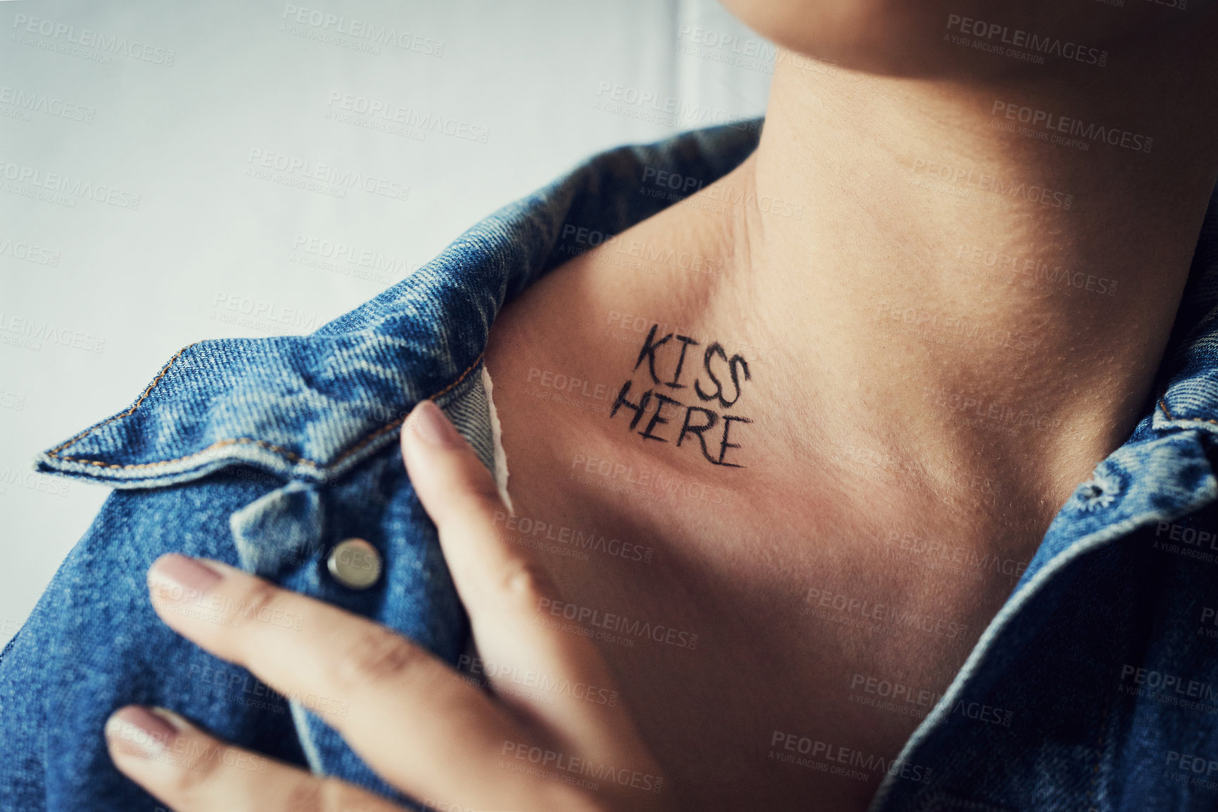 Buy stock photo Shot of an unidentifiable young woman revealing a written message reading 