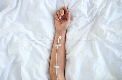 Buy stock photo High angle shot of earphones taped to an unrecognizable person's arm