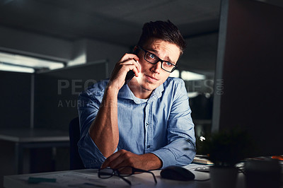 Buy stock photo Stressed, overworked and worried while talking on phone to solve problem while working late night at the office. Serious and exhausted man calling IT about computer issue trying to reach deadline