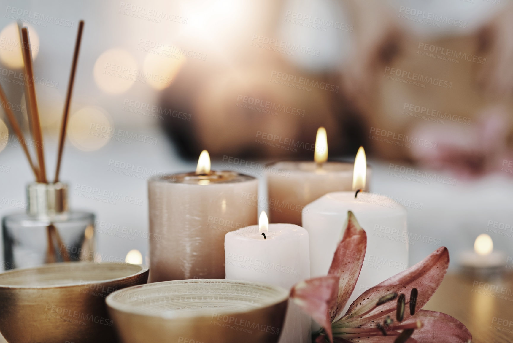 Buy stock photo Shot of a relaxed an cheerful young woman getting a massage indoors at a spa