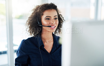 Buy stock photo Cropped shot of an attractive young female call center agent working in her office