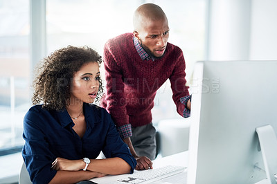 Buy stock photo Cropped shot of a male supervisor helping an attractive young businesswoman while working in their office