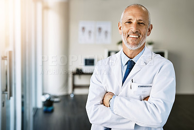 Buy stock photo Mature doctor, clinic and portrait with arms crossed in hospital feeling proud from medical work. Healthcare, wellness and professional employee with happiness from health support and physician job