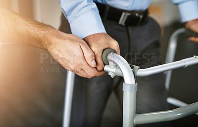 Buy stock photo Hands, walker and help for person with disability in nursing home, physiotherapy with empathy for arthritis. People, together and therapist with support for Parkinson in clinic, moving for healing