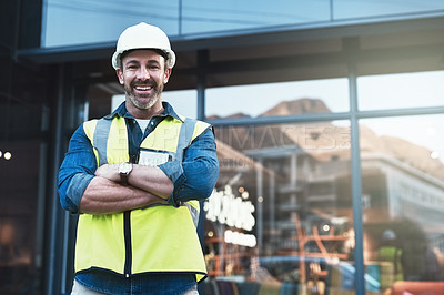 Buy stock photo Engineer, portrait of man architect standing in front of construction site and arms crossed. Industrial or architecture, project or management and happy mature male worker with safety helmet
