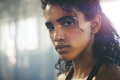 Buy stock photo Closeup shot of a focused young sportswoman posing in the gym