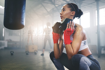 Buy stock photo Cropped shot of a young sportswoman busy working out in the gym