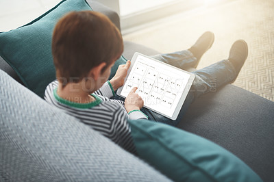 Buy stock photo Screen, game and child with tablet in living room for educational, entertainment or learning numbers. Home, above and little boy with technology on sofa for problem solving, strategy or logic in math