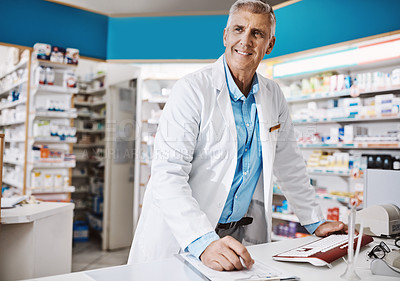 Buy stock photo Shot of a pharmacist working in a drugstore