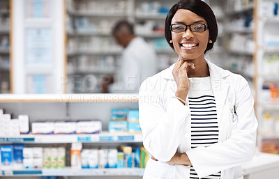 Buy stock photo Shot of a female pharmacist working in a drugstore