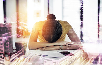 Buy stock photo Shot of a young designer with her head down on her office desk