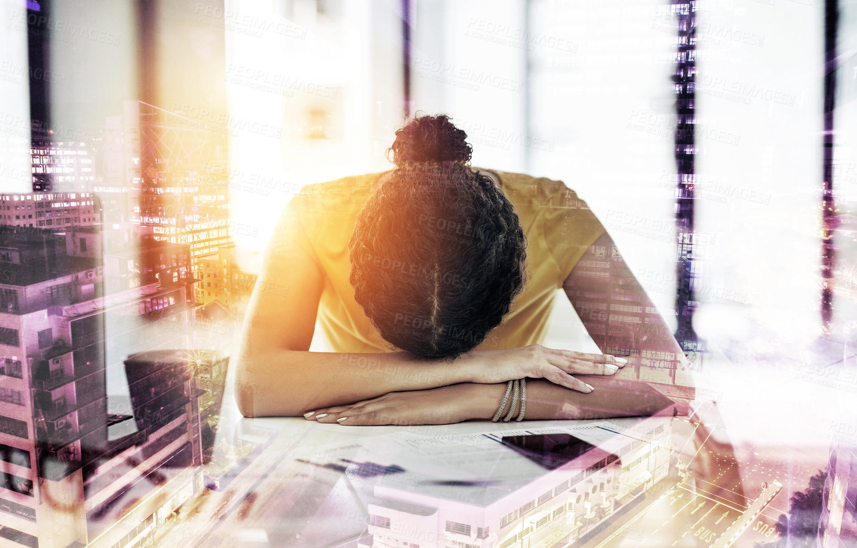 Buy stock photo Shot of a young designer with her head down on her office desk